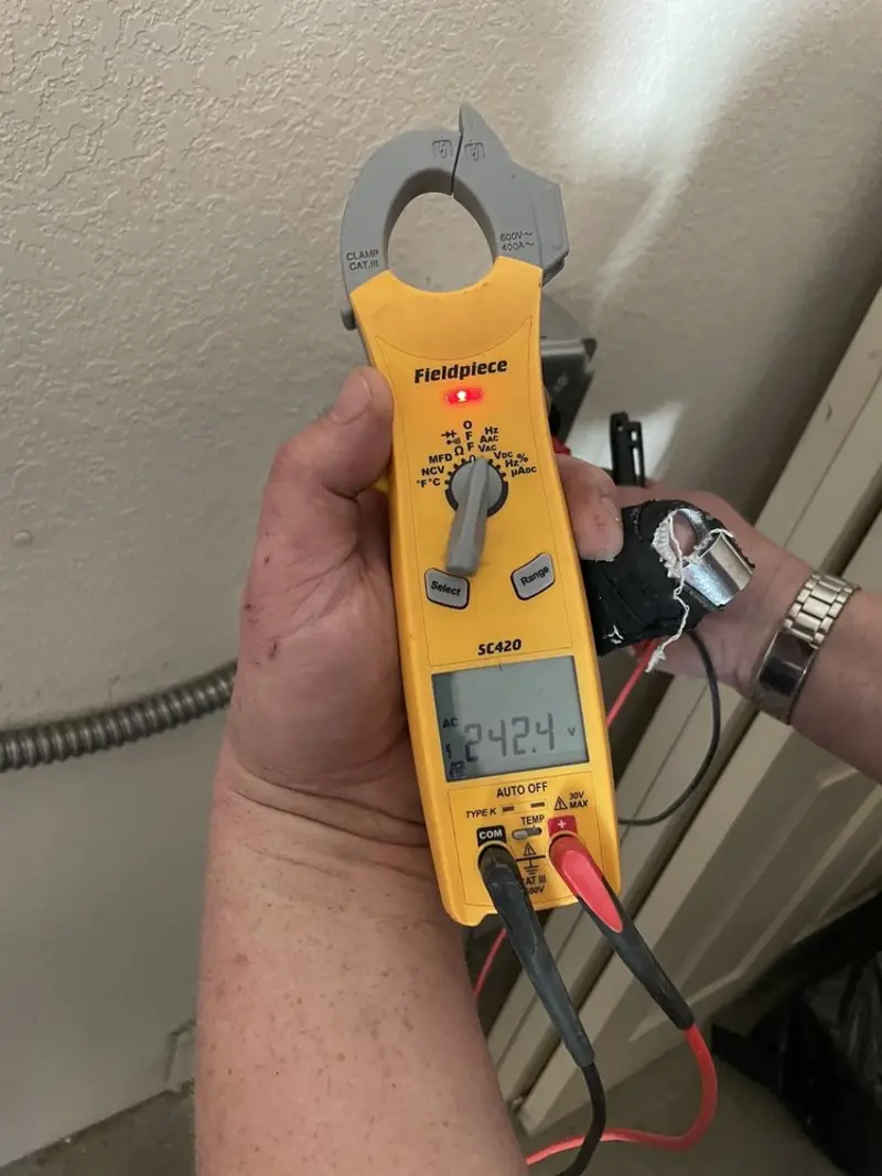 Voltage testing with clamp meter during Electrical Installation Services in Covedale